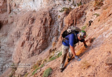 Brian traverses choosy rock during the approach to Whispering Falls Canyon.