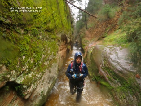 Eric making his way through wet narrows in Behunin Canyon.